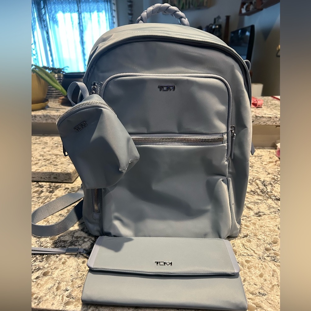 TUMI Halsey Voyager backpack in Halogen Blue, travel wallet, charm pouch